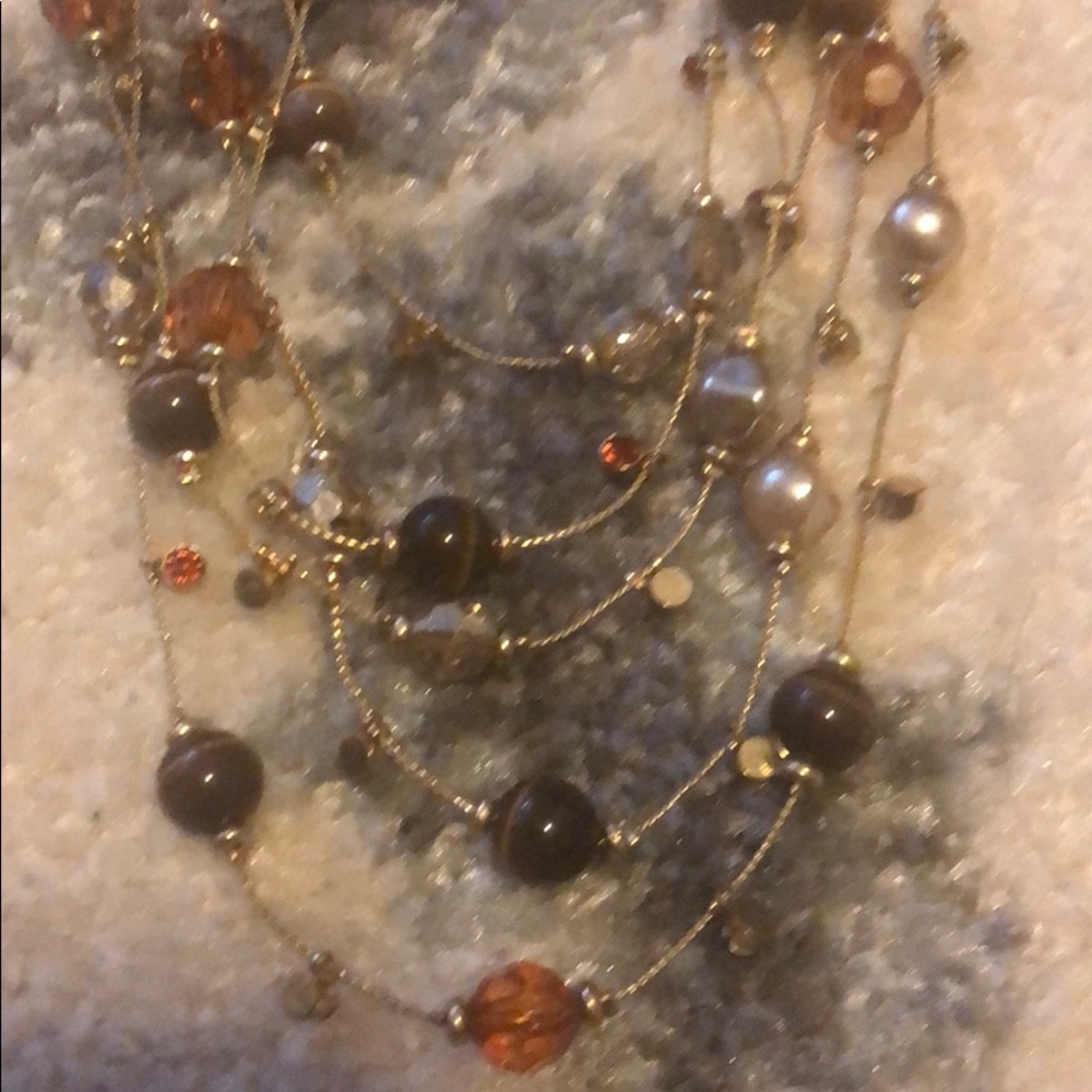 4 chain brown and tan beaded necklace. Must go